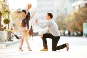 Young man proposing to a woman.