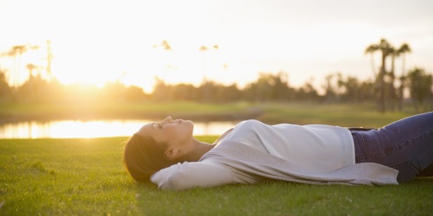 Woman laying in grass