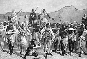 Engraving of Arab slave-trading caravan transporting African slaves across the Sahara.