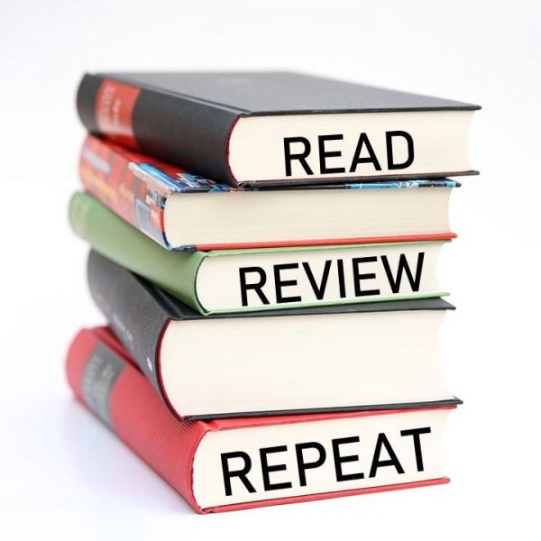 A stack of books and words Read - Review - Repeat